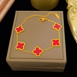 Elegant Gold and Red Clover Bracelet